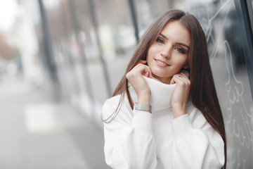 Fashion sensual woman portrait. Outdoor photo of attractive brunette model in a white shirt. Gorgeous portrait of a beautiful young blonde woman with with long beautiful hair outdoors in the summer