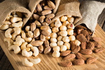 mix of nuts on a wooden table