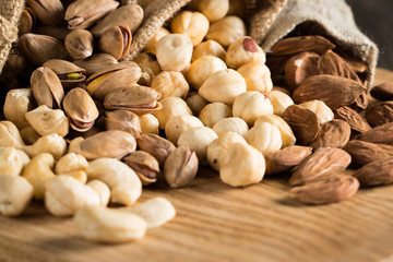 mix of nuts on a wooden table
