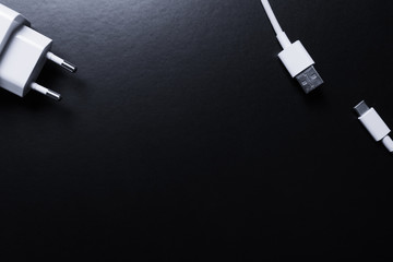 Closeup of USB cable. Isolated on black background 