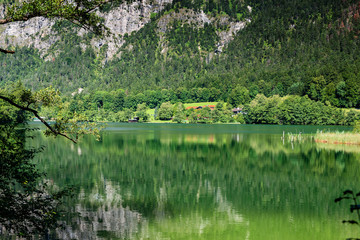 Fototapeta na wymiar Beautiful alpen mountain lake with green water