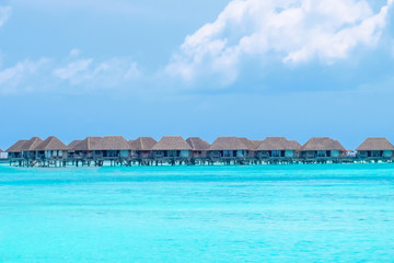 Villas on the tropical beach with steps into water