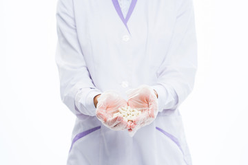 Medic doctor holding pills. Hands and pills close up. Treatment and health care. 