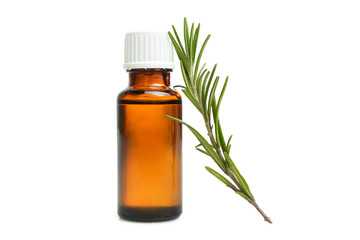 green rosemary branch and bottle of aroma oil