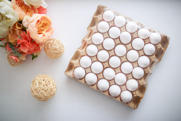 Easter eggs in box on white background