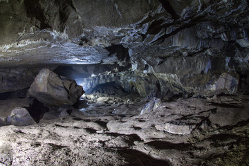 Obraz premium Giant voids, stone caves and tectonic cracks deep on planet Earth