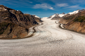 Salmon Glacier, Canada on a bright sunny day with a almost clear blue sky