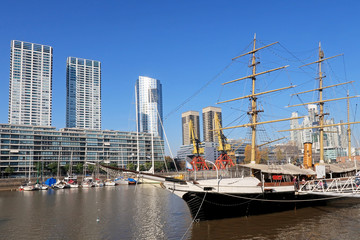 Historic sailing ship on Rio de la Plata river in the modern district Puerto Madero, Buenos Aires, Argentina