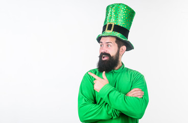 Pointing at something aside. Irish man with beard pointing his finger. Bearded man celebrating...