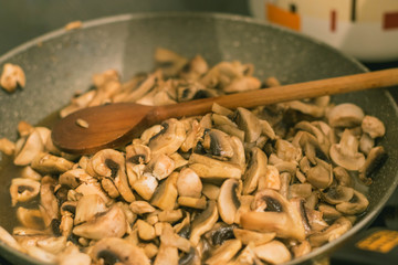 Young woman cooking in the kitchen