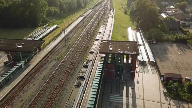 Drone view of a train leaving Dronten, Flevoland, The Netherlands.