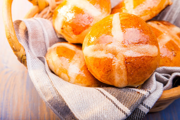 Hot cross buns on basket Top view, copy space. Easter baking