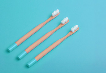 Flat lay composition with bamboo toothbrush space for text on color background