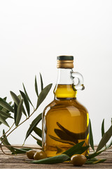 oil tree branch and bottle of oil  isolated on grey