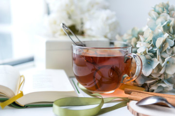 mug of tea, hydrangea, book, flowers