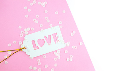 White gift tag with inscription love.