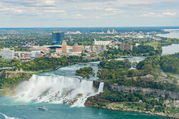Aerial view of a tourist ship driving pass the beautiful Niagara Falls