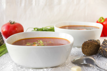 plate of soup, a bowl of red vegetable soup