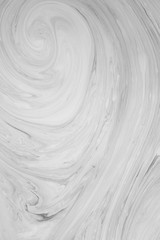 Abstract monochrome marble background. Stains of paint on the surface of the water.