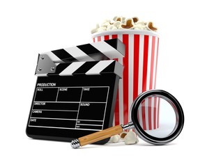 Popcorn and clapboard with magnifying glass