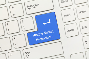 White conceptual keyboard - Unique Selling Proposition (blue key)