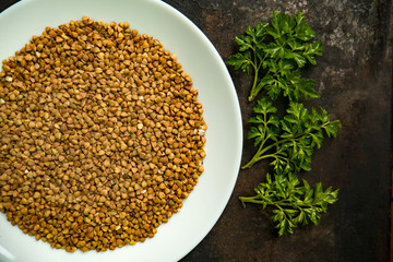 Buckwheat porridge on a white plate.