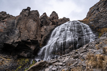 Fototapeta na wymiar The waterfall of the girl's braids in the Elbrus region near the village of Terskol