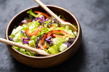 Greek salad with fresh vegetables, feta cheese and black olives