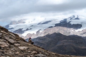 A beautiful mountain landscape with clouds, sky and trees, snow and river. Main Caucasian Ridge.