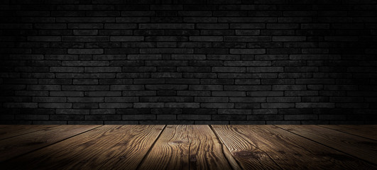 background of an empty black room, a cellar, lit by a searchlight. Brick black wall and wooden floor