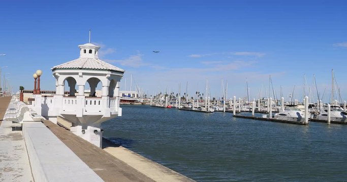 Corpus Christi Texas city shore walk marina pleasure fishing boats. South Texas tourism travel destination. Waterfront marina, port harbor and scenic byway.  