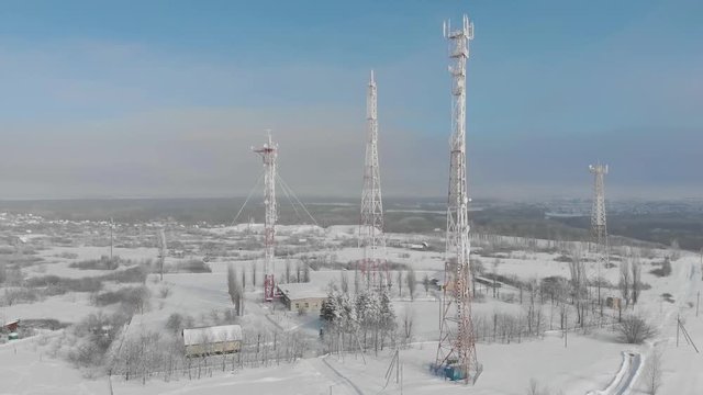 Aerial view frozen television towers in winter.