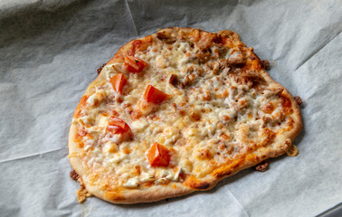 Homemade pizza with tomatoes