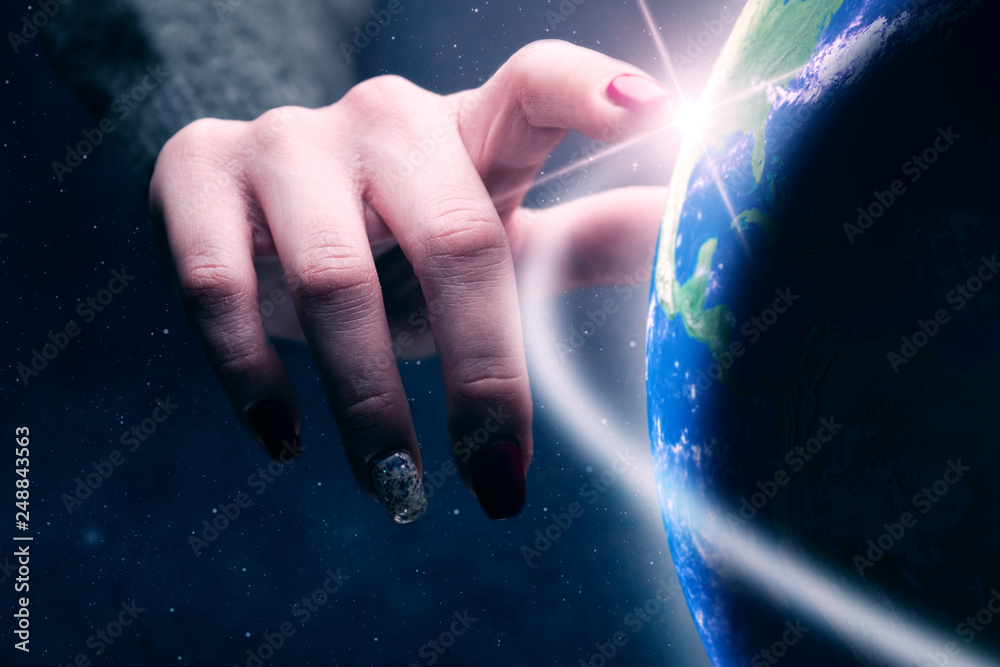 Aufkleber woman touching planet with finger. nebula dust in infinite space. mixed media.