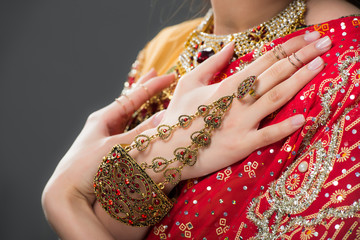 cropped view of indian woman in traditional accessories, isolated on grey