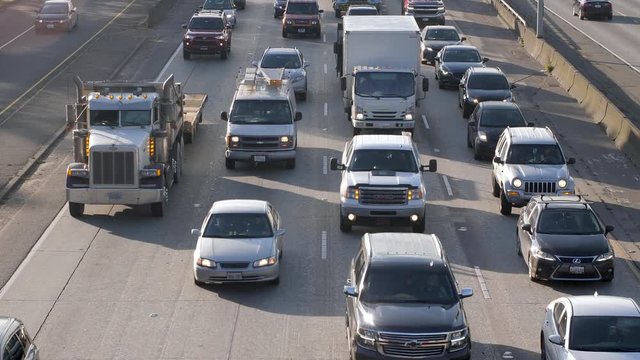 Cars driving through city traffic on I-5 in Seattle.