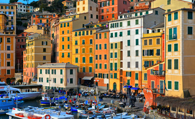 Fototapeta na wymiar Detail of harbour with fishing boats and fishermans in the old village of Camogli, Gulf of Paradise, Portofino National Park, Genova, Liguria, Italy