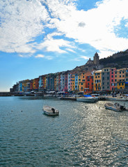 Picturesque panorama with landscape of the harbor with colorful houses and the boats in Porto Venere, Italy, Liguria