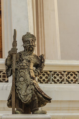 Fototapeta premium Cute stone of Chinese arts statue in Wat Suthat Temple, Bangkok, Thailand.