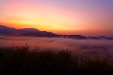 Dramatic sky before the sun rise and misty foreground the mountains landscape