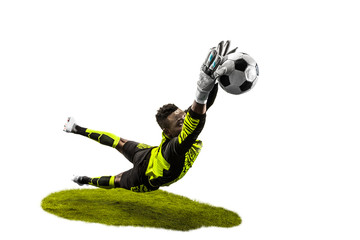 Male soccer player goalkeeper catching ball in jump. Silhouette of fit man with ball isolated on...