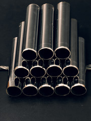 metal chrome pipes on a black background