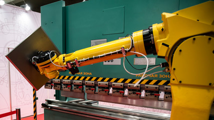 Robotic programmed robot arm. Industrial exhibition of machine tools.