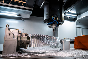 Cnc milling machine. Processing and cutting of parts from a piece of metal in the industrial area....