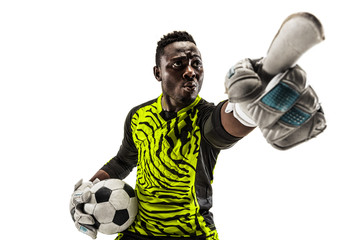 One african male soccer player goalkeeper pointing away and screaming isolated on white background. Appeal to the referee, order to defenders and human emotions concept