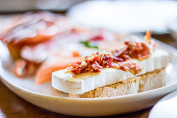 detail of brie cheese snack toast and ham