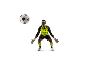 Fototapeta na wymiar Goalkeeper ready to save on white studio background. Soccer football concept