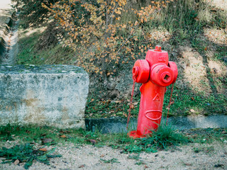 red fire hydrant on the countryside