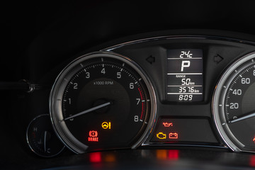 car dashboard and any symbol for alert.