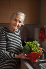 Elderly woman in the kitchen